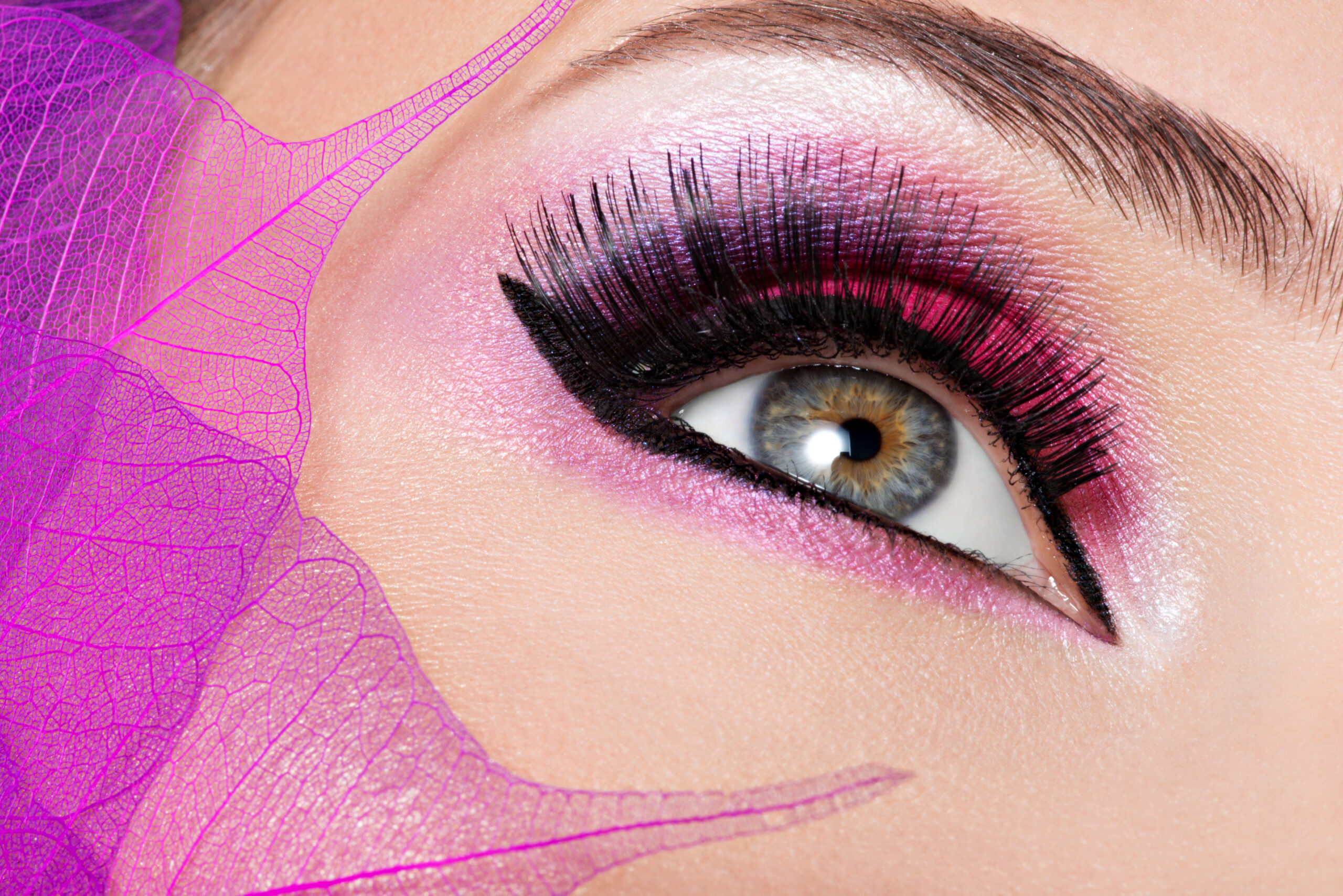 female eye with beautiful fashion bright pink makeup